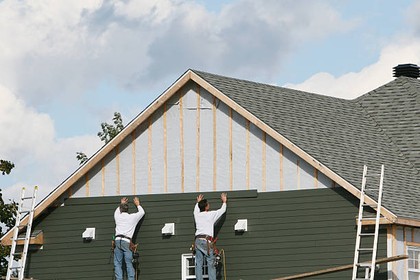 Professional Storm Damage Siding Repair technician working in Newtown, OH